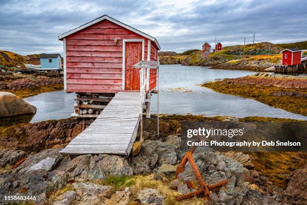 change island stages for fish processing in newfoundland - newfoundland and labrador stock pictures, royalty-free photos & images