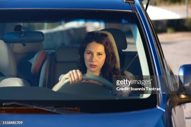 young woman in car - driver's seat stock-fotos und bilder