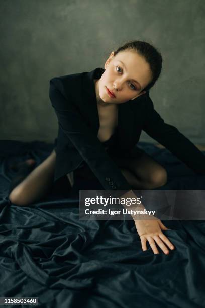 portrait of young woman looking at camera - tights stock-fotos und bilder