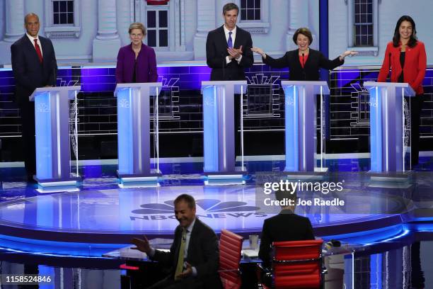 Sen. Amy Klobuchar gestures while the moderators Chuck Todd of NBC News and Rachel Maddow of MSNBC experience technical difficulties during the first...