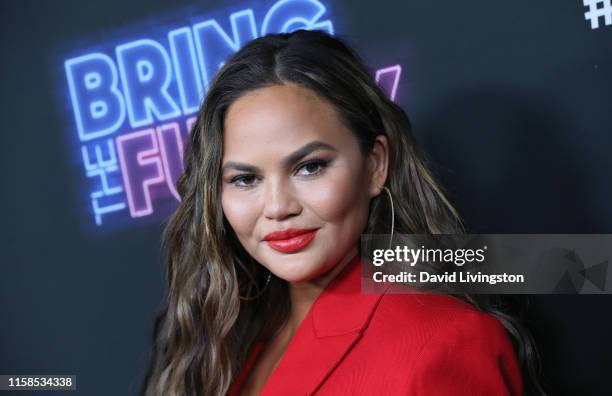 Chrissy Teigen attends the premiere of NBC's "Bring The Funny" at Rockwell Table & Stage on June 26, 2019 in Los Angeles, California.