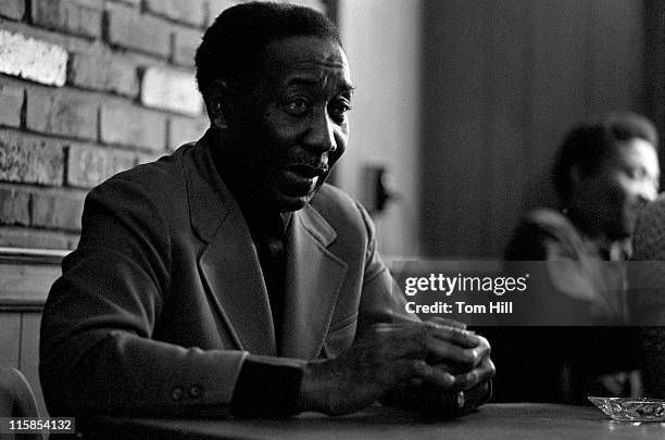 American Blues legend Muddy Waters plays cards with his band members backstage at Richards' Rock Club on May 29, 1972 in Atlanta, Georgia.