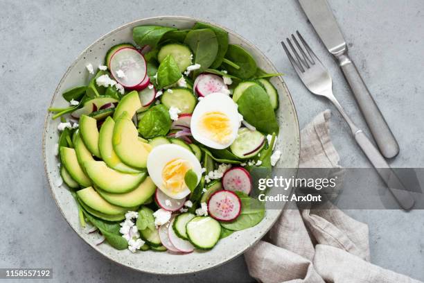 healthy salad bowl table top view - avocado stock-fotos und bilder