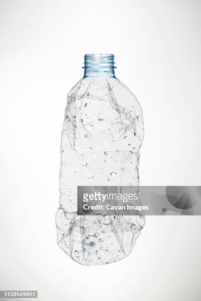 used water bottle and white background - bottle water fotografías e imágenes de stock