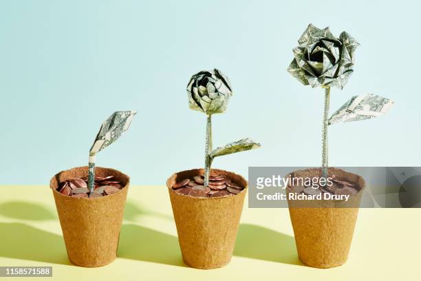 three origami dollar flowers in a row - origami flower stock pictures, royalty-free photos & images