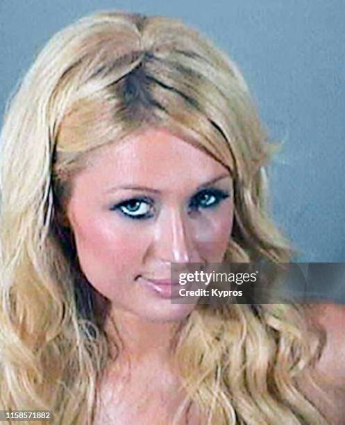 In this handout, American media personality, businesswoman, socialite, model, singer, and actress Paris Hilton in a mug shot after her arrest for...