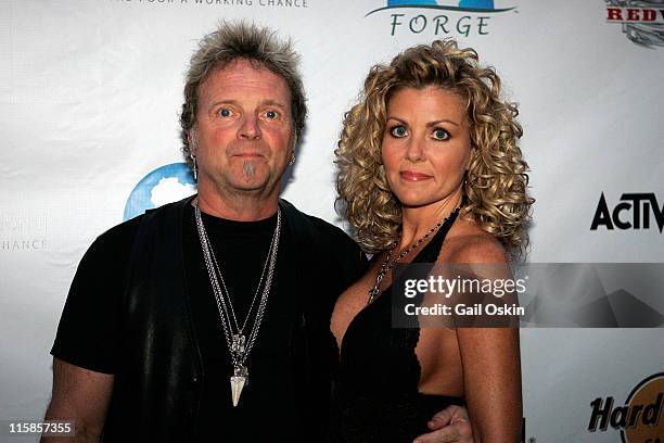 Joey Kramer, drummer for Boston rock band Aerosmith, and girlfriend Linda attend the "Guitar Hero: Aerosmith" event at the Hard Rock Cafe on August...