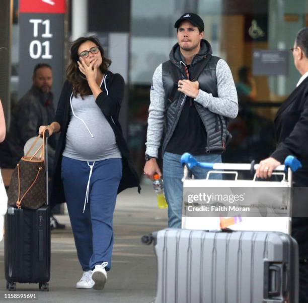 Robbie Amell and his pregnant wife Italia Ricci are seen arriving at Perth Airport on June 27, 2019 in Perth, Australia.