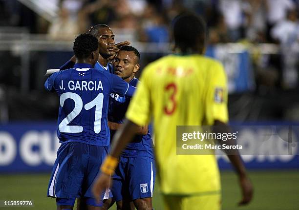 Jerry Bengstson of Honduras celebrates a goal against Grenada with teammates Oscar Boniak Garcia and Juan Carlos Garcia at FIU Stadium on June 10,...