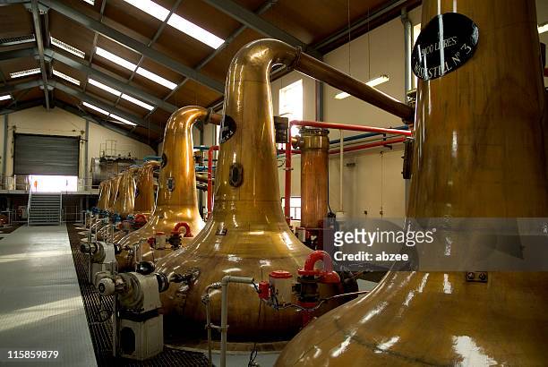 stills inside a scottish whiskey distillery - whisky distillery stock pictures, royalty-free photos & images
