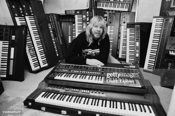 English keyboardist, songwriter, producer, television and radio presenter, and author Rick Wakeman with his collections of keyboards, UK, 1st October...