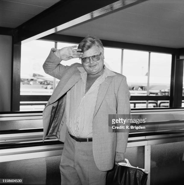 English comedian and actor Benny Hill at an airport, UK, 30th September 1984.