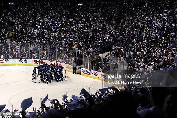 The Vancouver Canucks celebrate after defeating the Boston Bruins by a score of 1-0 in Game Five of the 2011 NHL Stanley Cup Final at Rogers Arena on...