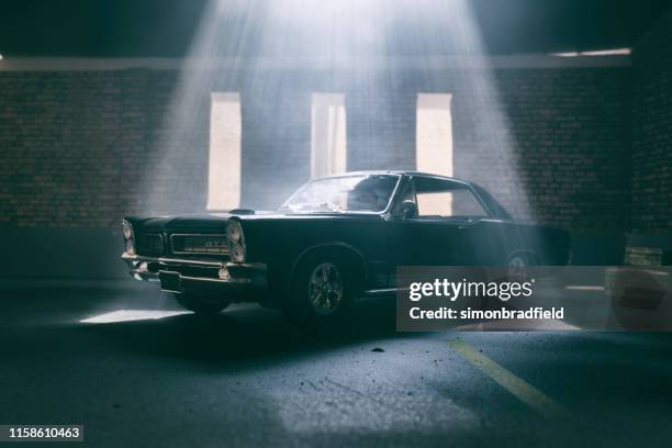 model pontiac gto in atmospheric garage - collectors car stock pictures, royalty-free photos & images