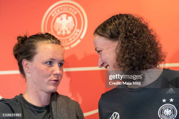 Almuth Schult and Marina Hegering of Germany attend a press conference on June 27, 2019 in Pont-Pean near Rennes, France.