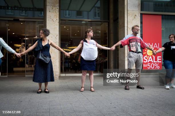 Hanover, Germany On "Earth Overshoot Day", climate activists pointed out the exploitative use of the earth with a human chain and other...