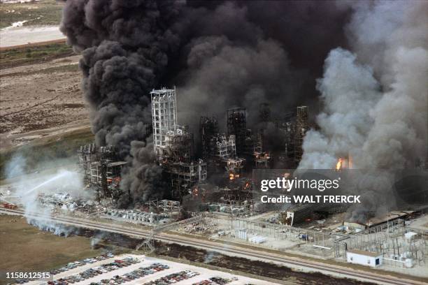 Flames and smoke pour from the Phillips 66 Chemical Plant Houston on October 23, 1989 after a noon exploion caused extensive damage and injuries. -...