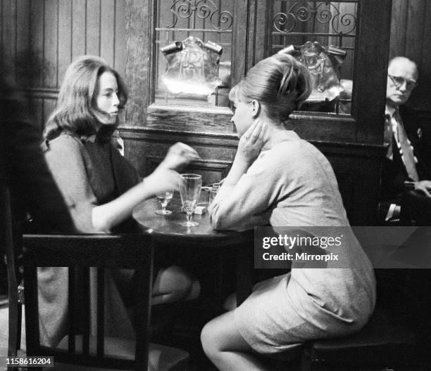 Christine Keeler and Mandy Rice-Davies taking a break from the trial of society osteopath Stephen Ward at the Old Bailey on Monday 22nd July 1963....