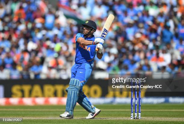 Dhoni of India plays a shot for six during the Group Stage match of the ICC Cricket World Cup 2019 between West Indies and India at Old Trafford on...