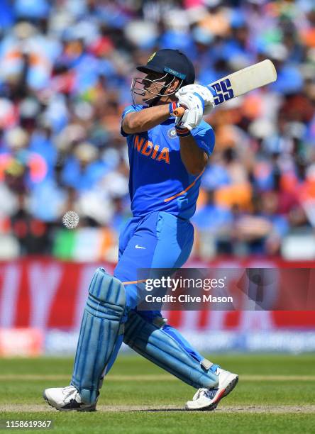 Dhoni of India in action batting during the Group Stage match of the ICC Cricket World Cup 2019 between West Indies and India at Old Trafford on June...