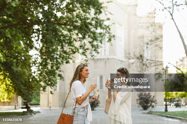 eating souvlaki in plaka, athens - athens - greece stock pictures, royalty-free photos & images