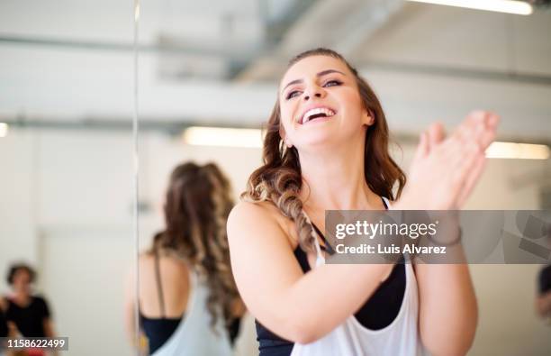 woman applauding after dance practice in class - zumba class stock pictures, royalty-free photos & images