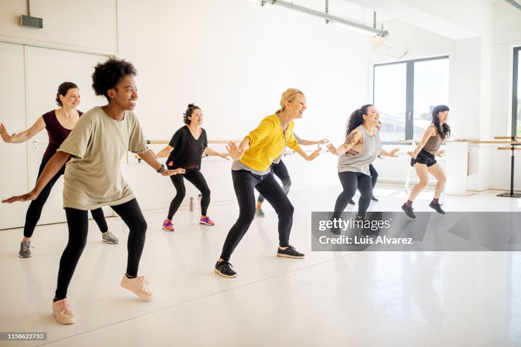 Women doing dance workout at health club