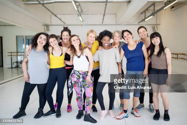 portrait of multi-ethnic females at fitness dance studio - frauenpower stock-fotos und bilder