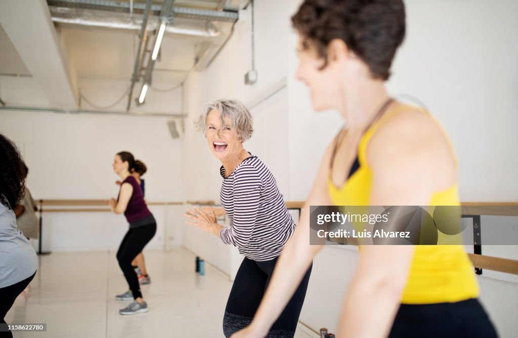 Women enjoying a dance routine in fitness studio