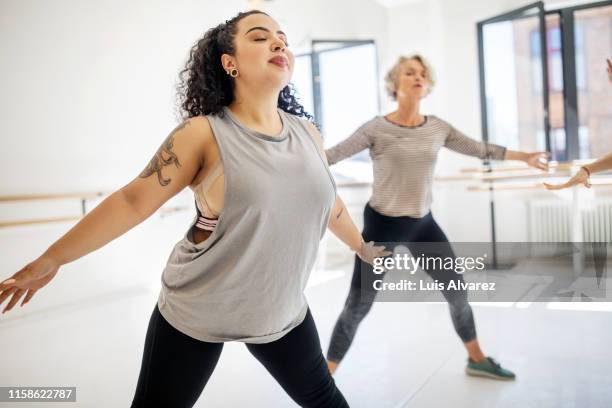 women doing fitness dance at health club - mature woman beauty arm stockfoto's en -beelden