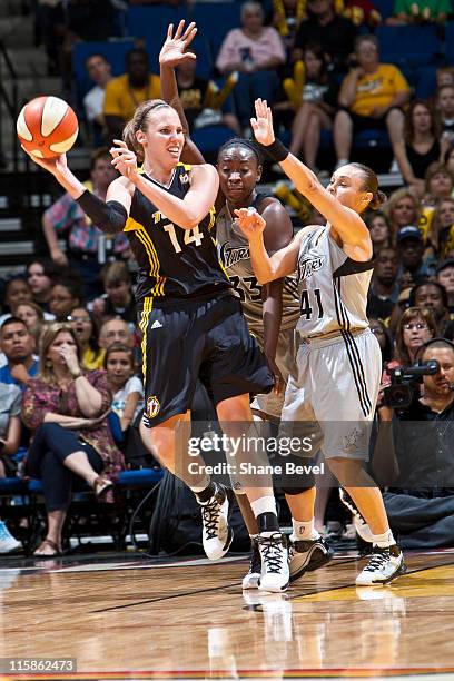 Sophia Young and Tully Bevilaqua of the San Antonio Silver Stars put pressure on a trapped Kayla Pedersen of the Tulsa Shock during the WNBA game on...