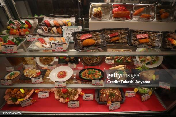 Plastic replica of food are displayed at a restaurant in the Shinsekai area on June 27, 2019 in Osaka, Japan. U.S. President Donald Trump arrived in...