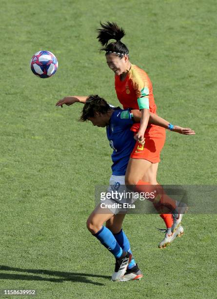 Valentina Giacinti of Italy and Wu Haiyan of China fight for the ball during the 2019 FIFA Women's World Cup France Round Of 16 match between Italy...