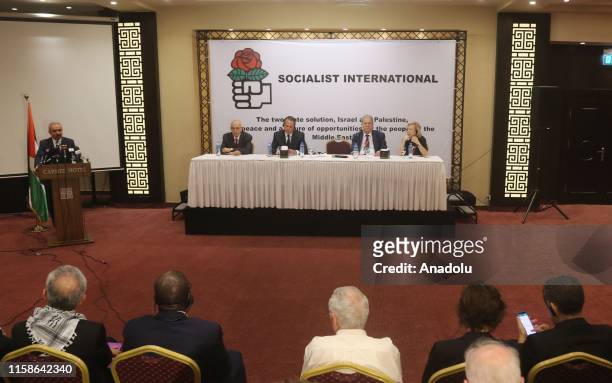 Palestinian Prime Minister Mohammad Shtayyeh speaks during the opening of the annual meeting of Council of the Socialist International on "The Two...