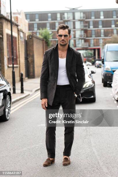 Model David Gandy wears a Thom Sweeney suit, Finlay and Co sunglasses, David Gandy for Marks and Spencers Autograph Collection vest and Edward Green...