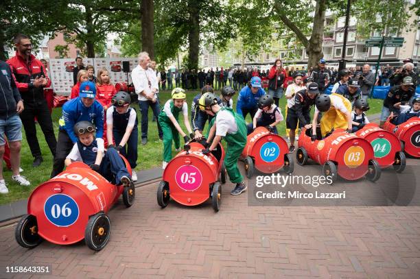 The MotoGP riders joke during the pre-event "MotoGP riders makes the Team Managers for a soap-box karting competition in a local school in the centre...