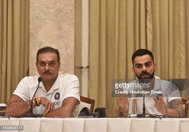 Indian cricket captain Virat Kohli with head coach Ravi Shastri during a press conference before West Indies tour, at ITC hotel in Andheri, on July...