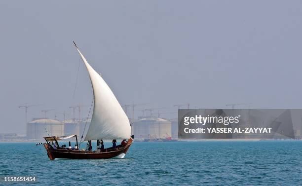 Pearl diving boats arrive for the annual pearl diving season on July 30, 2019 off the coast of the port city of Khairan, 100 kms south of Kuwait...