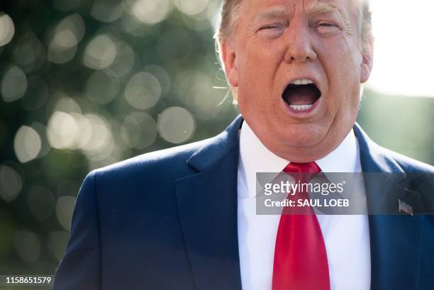 President Donald Trump speaks to the media prior to departing from the South Lawn of the White House in Washington, DC, July 30 as he travels to the...