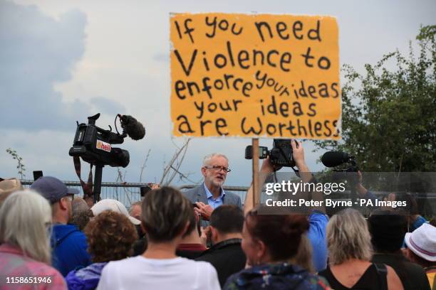 Jeremy Corbyn speaks to anti-fracking protestors outside the gate at the Preston New Road shale gas exploration site in Lancashire.