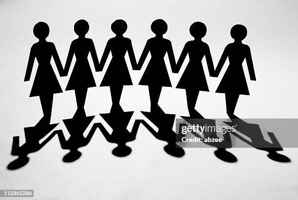 paper chain of women with shadow - paper man stock pictures, royalty-free photos & images