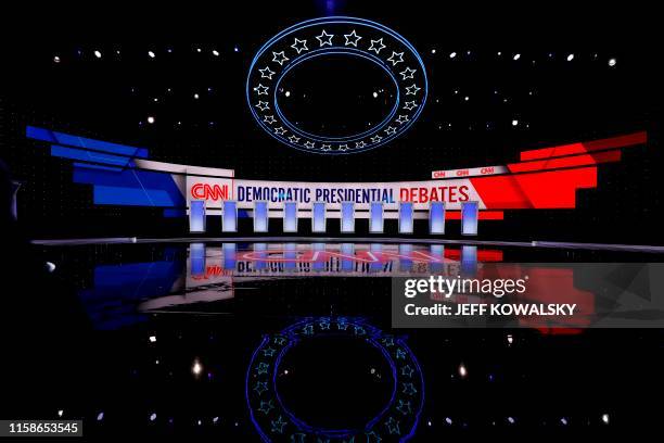 Workers prepare the debate stage at the Fox Theater in Detroit, Michigan, on July 30 ahead of the 2nd Democratic Presidential Debate. - Leading...