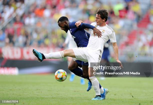 Georges-Kévin Nkoudou of Tottenham Hotspur competes with Alvaro Odriozola of Real Madrid during the Audi Cup 2019 semi final match between Real...