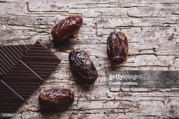 dates and chocolate. - date fruit stock pictures, royalty-free photos & images