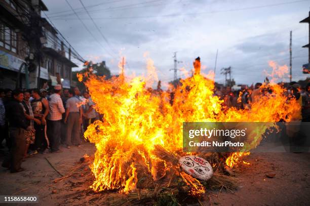 Nepalese devotees celebrate by burning effigy of demon Ghantakarna during the Ghantakarna or Gathemangal festival celebrated at Bhaktapur, Nepal on...