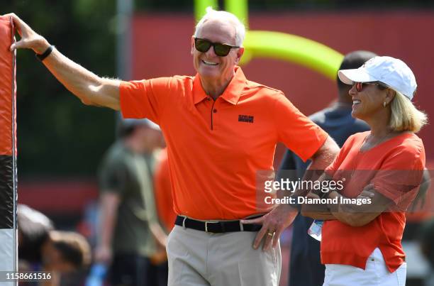 Owners Jimmy and Dee Haslam on the field during a training camp practice on July 25, 2019 at the Cleveland Browns training facility in Berea, Ohio.
