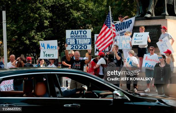 Supporters of US President Donald Trump demonstrate at Grand Circus Park on July 30 in Detroit, Michigan. - Democratic presidential candidates will...