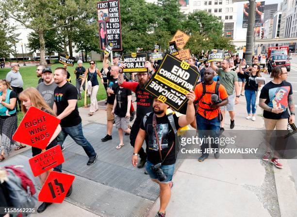 Activist demonstrate at at Grand Circus Park on July 30 in Detroit, Michigan. - Democratic presidential candidates will debate in Detroit July 30 and...