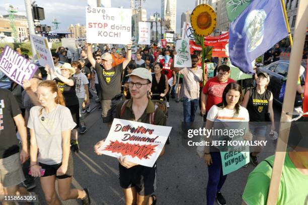 Protesters march down Woodward Ave. In front of the Fox Theatre on July 30, 2019 in Detroit, Michigan. - Democrat presidential candidates will debate...