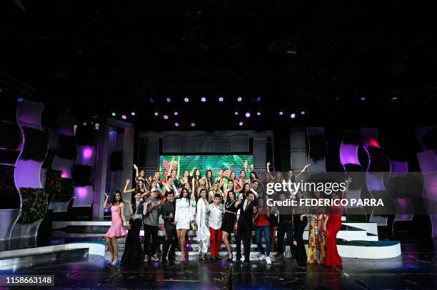 Hosts of the event and contestants pose during a 2019 Miss Venezuela beauty contest rehearsal in Caracas, Venezuela, on July 30, 2019. - For the...